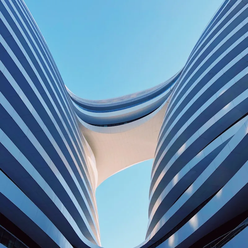 Curved canopy soffit against open sky