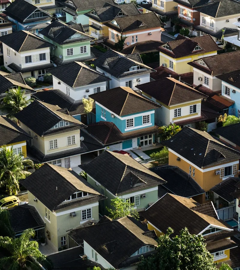 Dense hillside housing stacked to the ridge