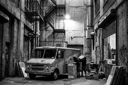 Van loaded with boxed records in the goods alley