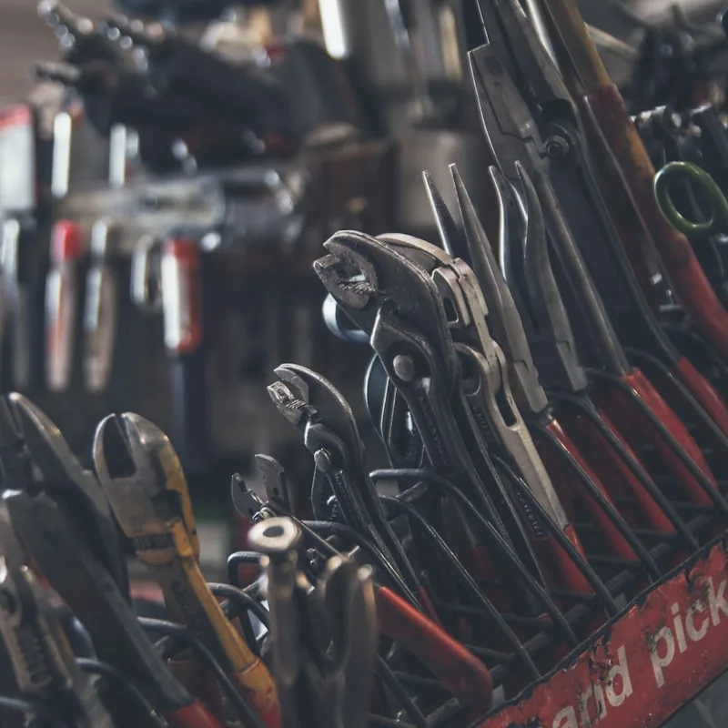 Hand tools racked above the plating bench