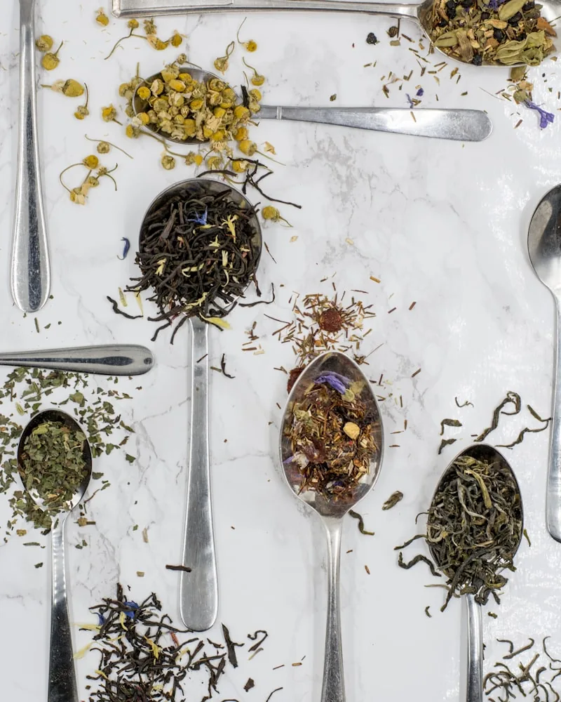 Dried botanicals measured out on spoons