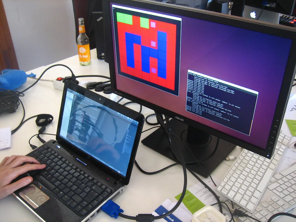 developer desk with code on screen